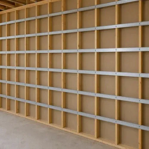 Resilient channel installed over studs to decouple the drywall from the framing